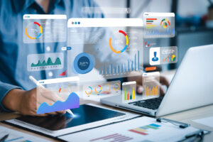 a person using a tablet and a laptop